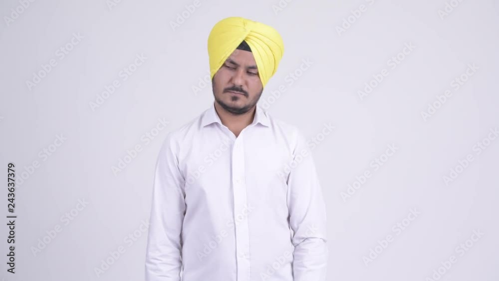 Bearded Indian Sikh businessman opening empty gift box Bearded Indian Sikh businessman opening empty gift box