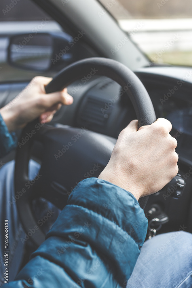 Man hands on the steering wheel Man hands on the steering wheel