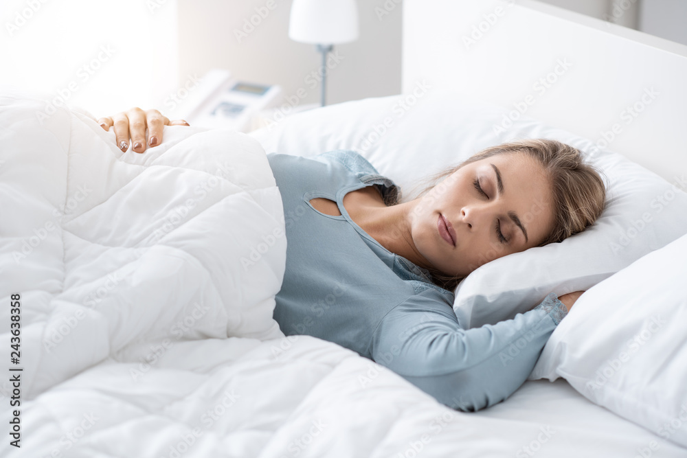 Young woman sleeping in the bedroom - obrazy, fototapety, plakaty 