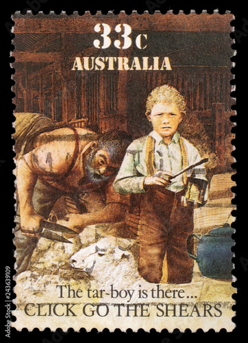 Stamp printed in Australia shows sheepshearing, Tar-boy is there, circa 1986 photo