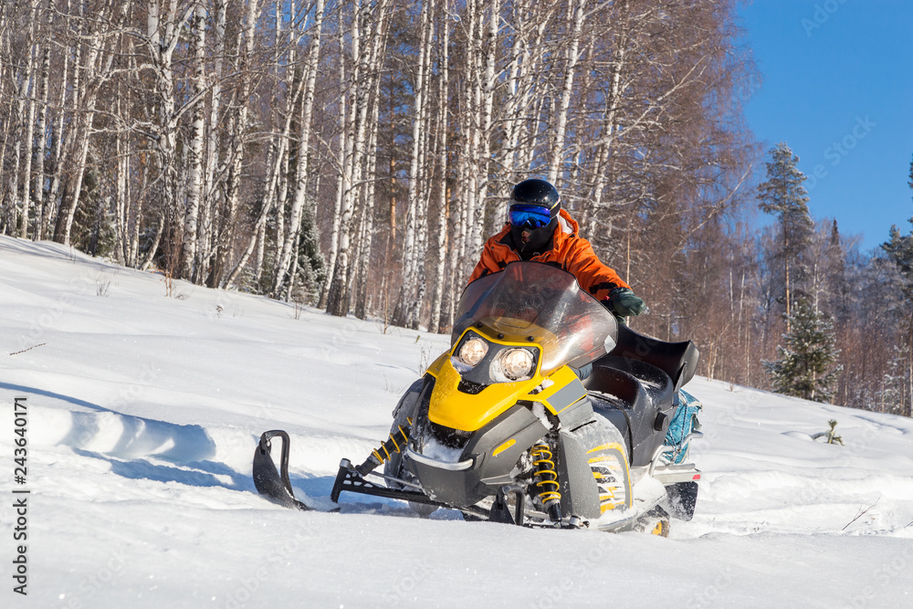 Athlete on a snowmobile.