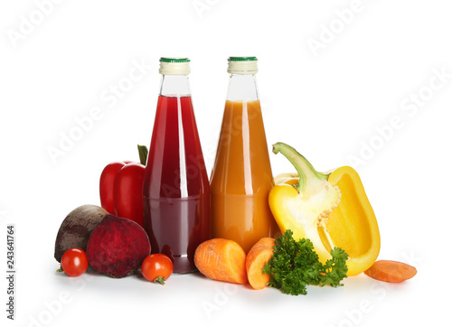 Fototapeta Naklejka Na Ścianę i Meble -  Bottles of healthy vegetable juice on white background
