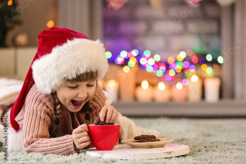 Cute little girl in Santa h...