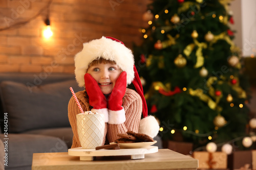 Happy little girl in santa ...