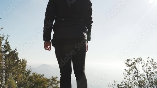 The guy on the observation deck looks at a beautiful view of the mountains photo