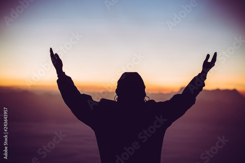 Man celebrating worship god in morning. Christian thought positive over sunset inspire praise for peace cross concept for freedom financial, vision and mission, self motivation, hope life love