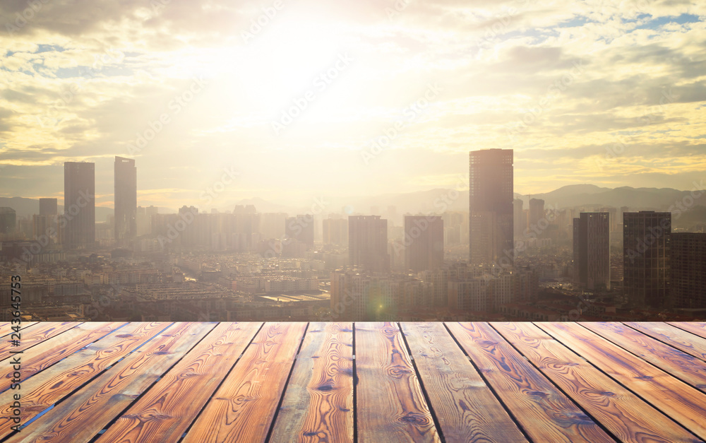 City concept: Wood table top on blur glass window wall building background