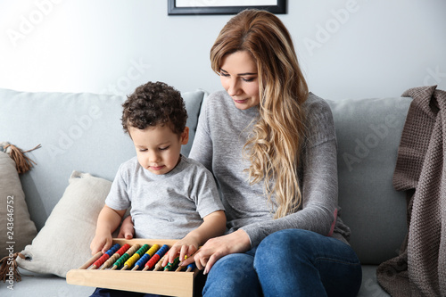 Young mother with cute litt...