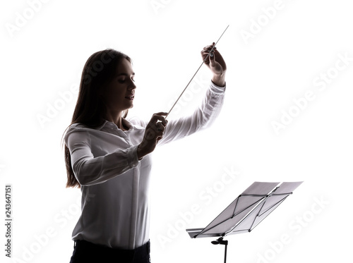 Silhouette of young orchest...
