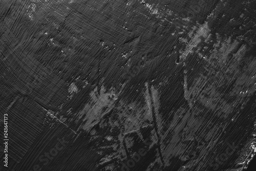 black paint smeared on the wall. Dark background, substrate for work.