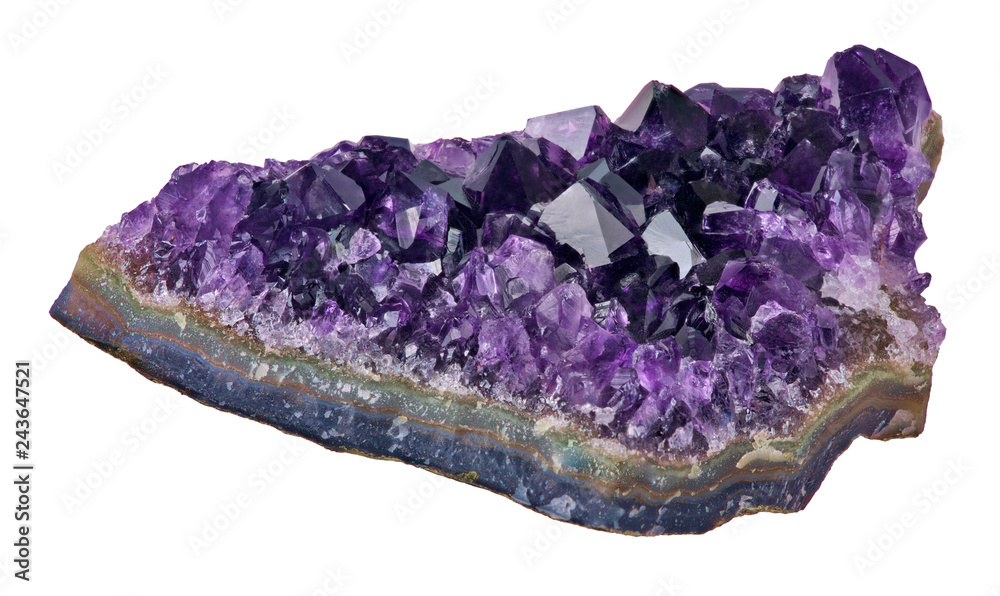 dark deep color amethyst in geode on white dark deep color amethyst in geode on white