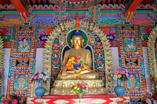 figure of Buddha and Prayer flag in the Five Pagoda Temple, Hohhot city, Inner Mongolia autonomous region, China