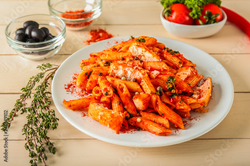 Tasty pasta with tomato sauce on plate