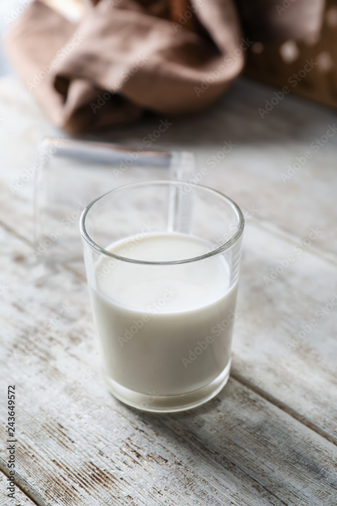 Glass of fresh milk on wooden table Glass of fresh milk on wooden table