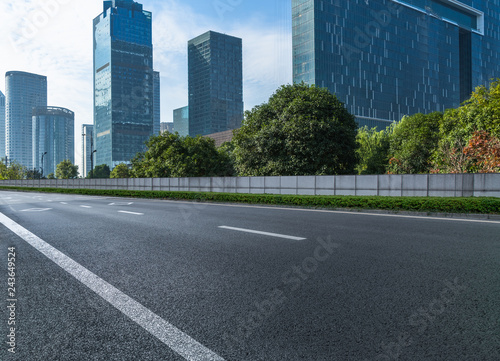 Empty asphalt road through modern city in Shanghai, China.