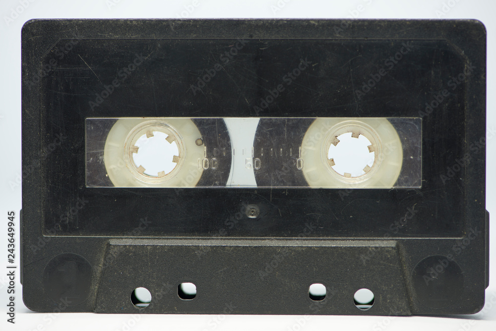 Obraz premium A black cassette tape on a white background