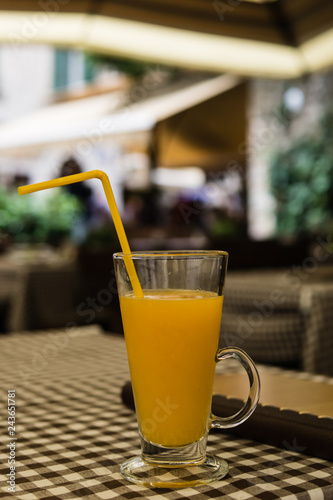 Glass of orange juice in a restaurant