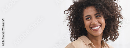 Black girl with white smile, copy space photo