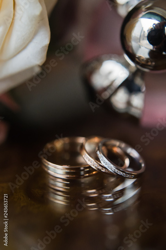 wedding rings with diamonds of the bride and groom, close-up