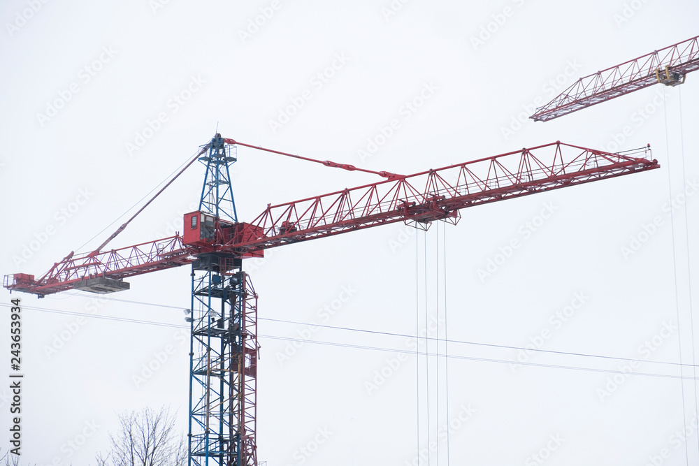 Tower cranes in a winter day Tower cranes in a winter day
