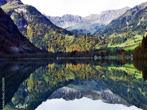 Alpine lake Klontalersee in Klontal valley and mountain range Glarus Alps - Canton of Glarus, Switzerland photo