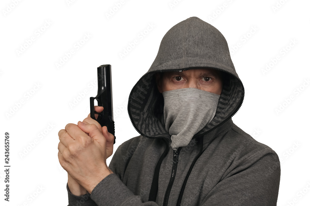The man keeps a gun about the head in a mask. White background The man keeps a gun about the head in a mask. White background