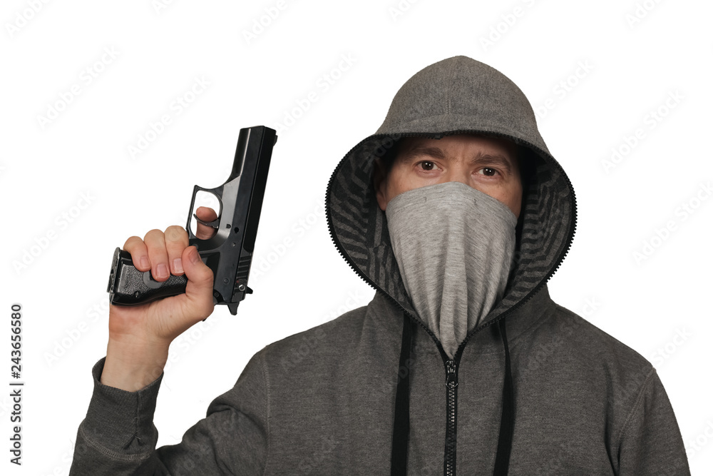 The man keeps a gun about the head in a mask. White background The man keeps a gun about the head in a mask. White background