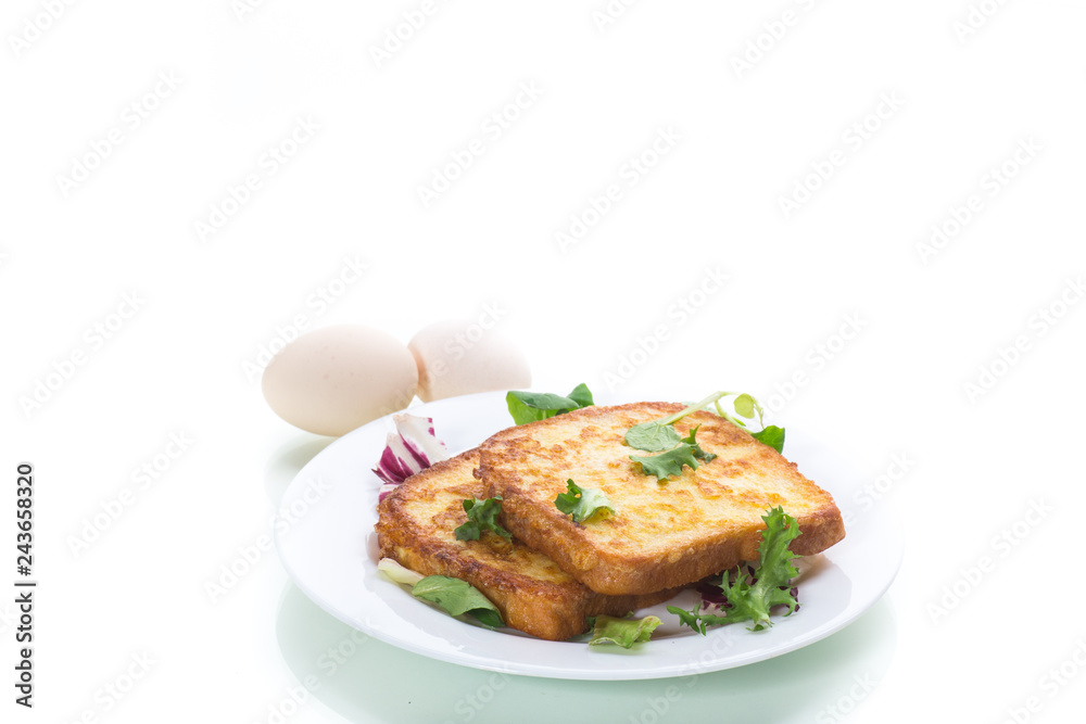 fried croutons in eggs with greens in a plate fried croutons in eggs with greens in a plate