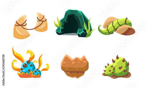 Vector set of cartoon landscape elements for fantastic mobile game. Cave, stones and green plants. Gaming assets