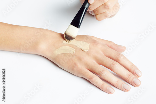 Hand with make up and brush