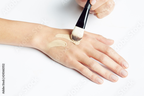 Hand with make up and brush