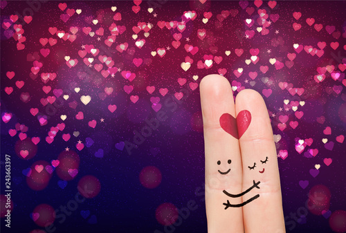 Two fingers while smiling face with nature hearts background. Happy couple in love
