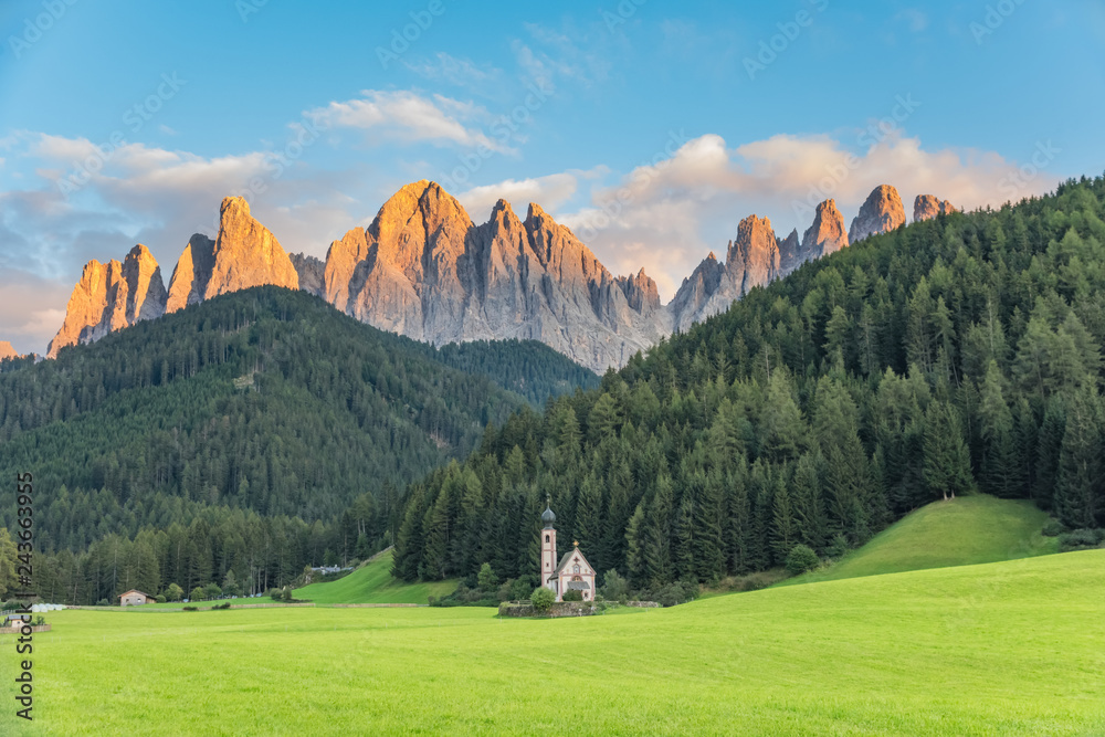 Wonderful Sunny Landscape of Dolomite Alps. St Johann Church, Santa Maddalena, Val Di Funes, Dolomites, Italy. Amazing nature Background