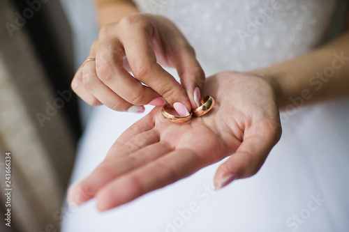 Wedding ring. The bride is holding wedding rings