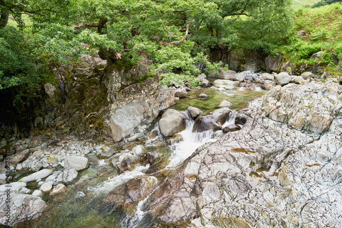 Fast flowing clear water of Galleny Force near Stonethwaite in the English Lake District. photo