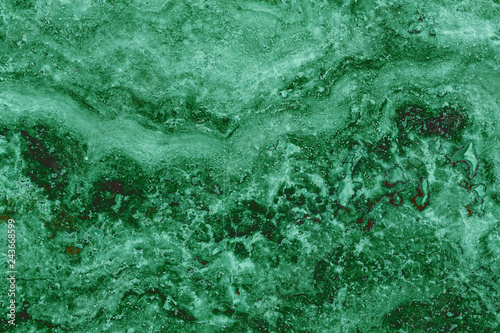the texture of artificial marble green emerald color with a beautiful pattern similar to the mineral malachite.
