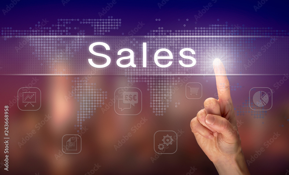 A hand selecting a Sales business concept on a clear screen with a colorful blurred background.