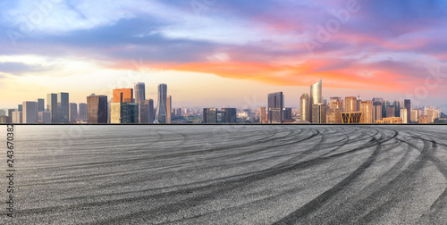Empty asphalt road and city skyline at sunrise in hangzhou,high angle view © ABCDstock