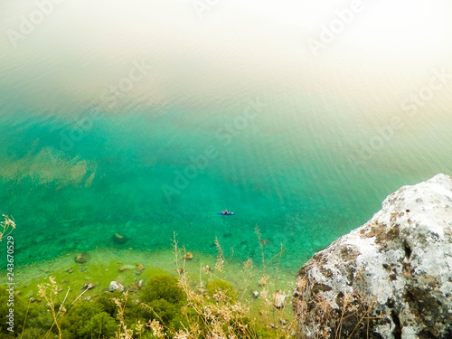 Canoeing in beautiful water of Lake Ochrid. Nature background.