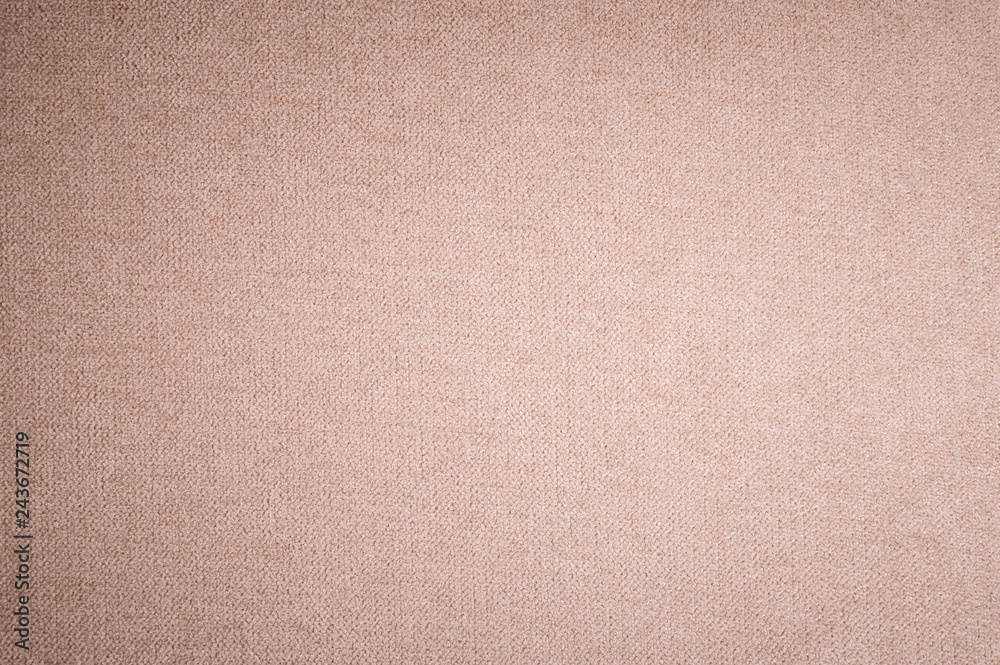 Fototapeta premium Textured background surface of textile upholstery furniture close-up. burlap beige color fabric structure