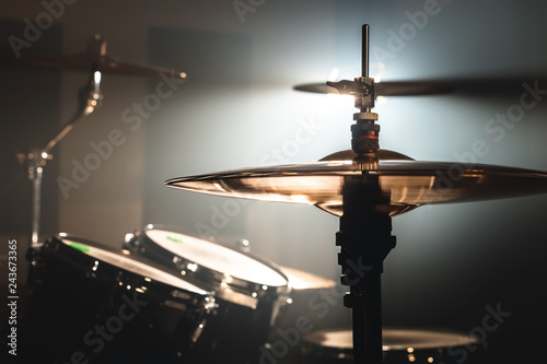 Wall Mural Close-up Drum set in a dark room against the backdrop of the spotlight