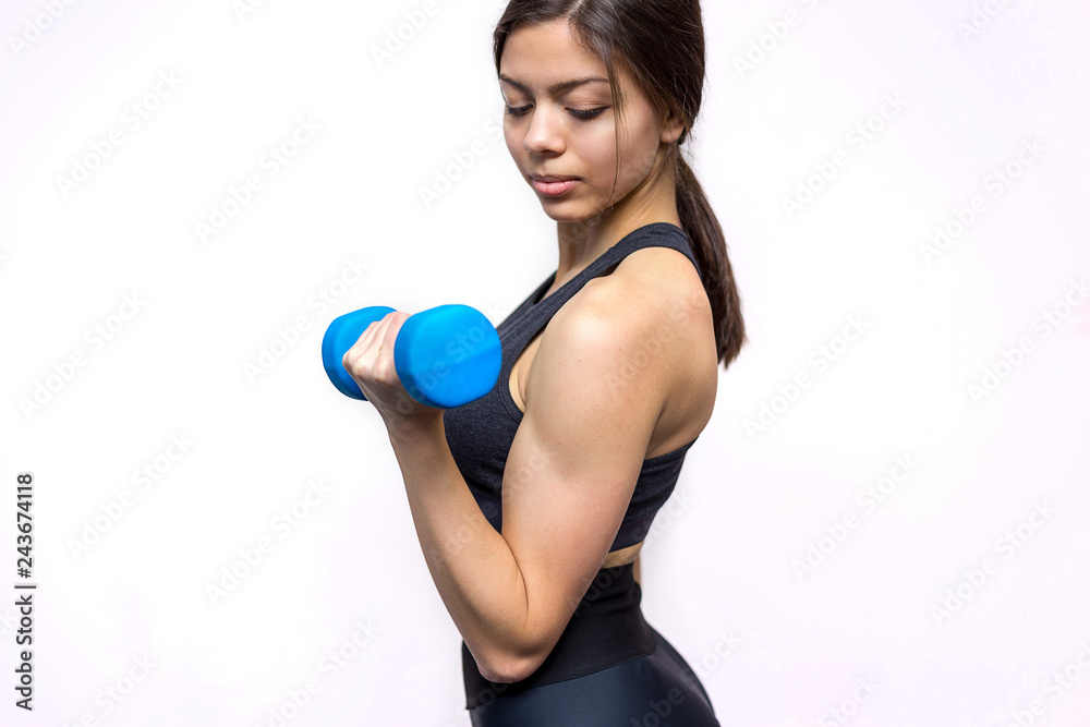 pretty sporty girl doing exercises with dumbbells pretty sporty girl doing exercises with dumbbells