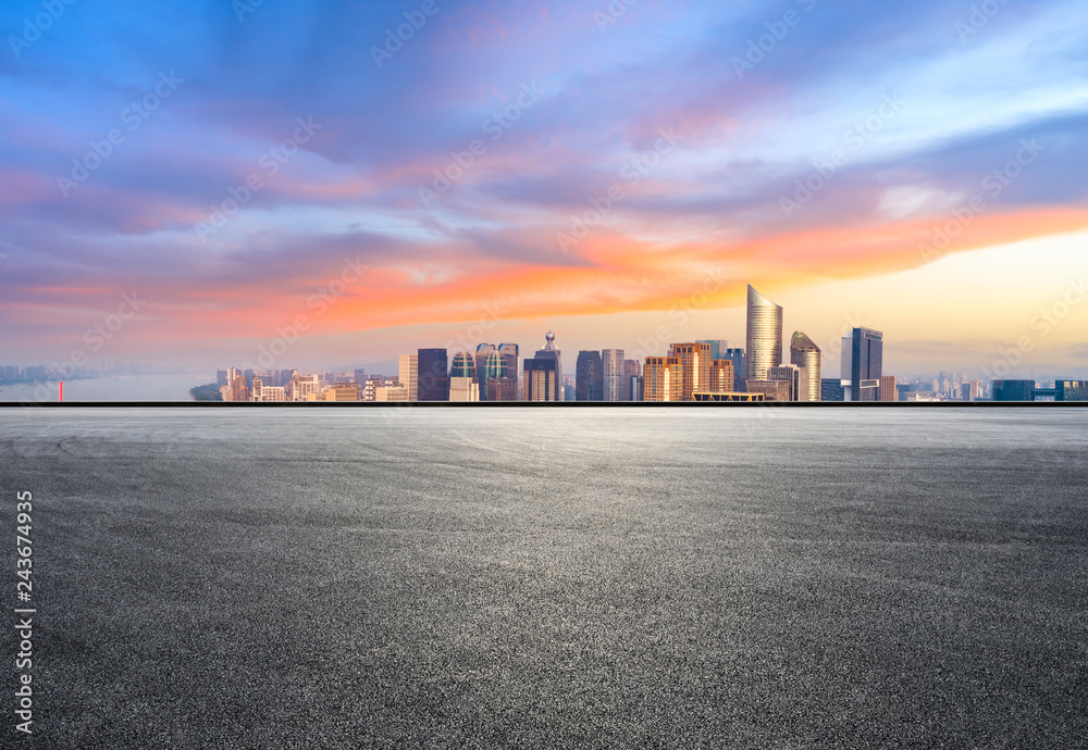 Asphalt square ground and city skyline in Hangzhou at sunrise,high angle view