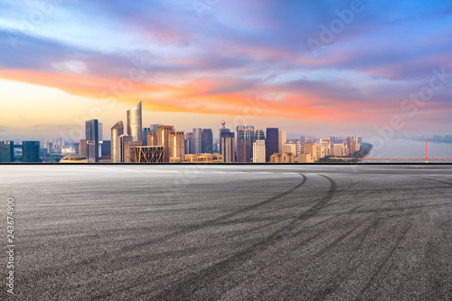 Asphalt square ground and city skyline in Hangzhou at sunrise,high angle view