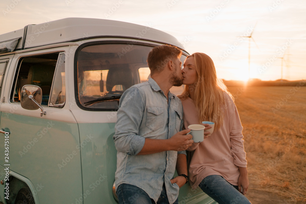 Young couple kissing during sunset Young couple kissing during sunset