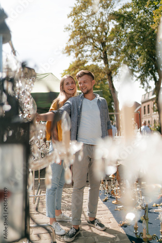 Belgium, Tongeren, happy young couple on an antique flea market photo