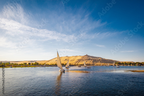 River nile with traditional boats at sunset. Live on the river Nile photo