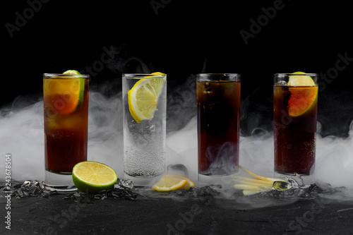 cocktails on a black background with smoke