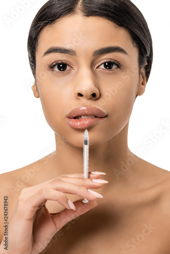 attractive african american girl doing beauty injection in lips and looking at camera isolated on white