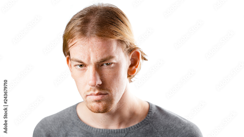 Obraz premium Male portrait of a fair-haired man of European appearance, on a white background. Emotions.